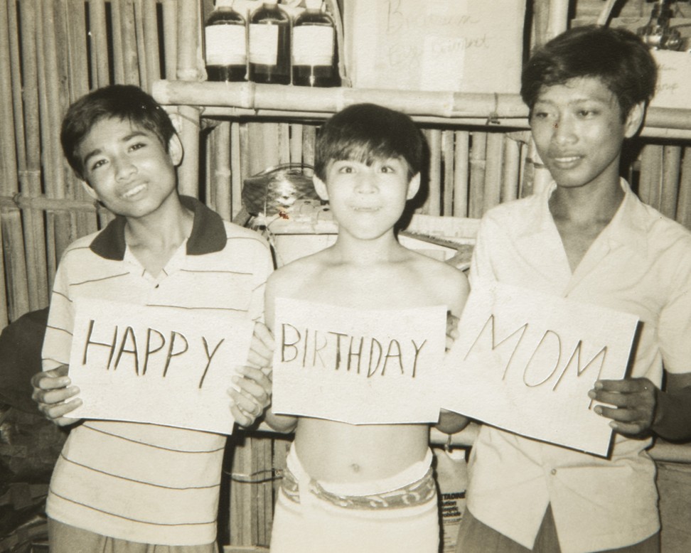 Vira Rama (centre) with his brother Monyroth (left) and friend Rithy (right) at a refugee camp in 1980. Photo: Charles Fox