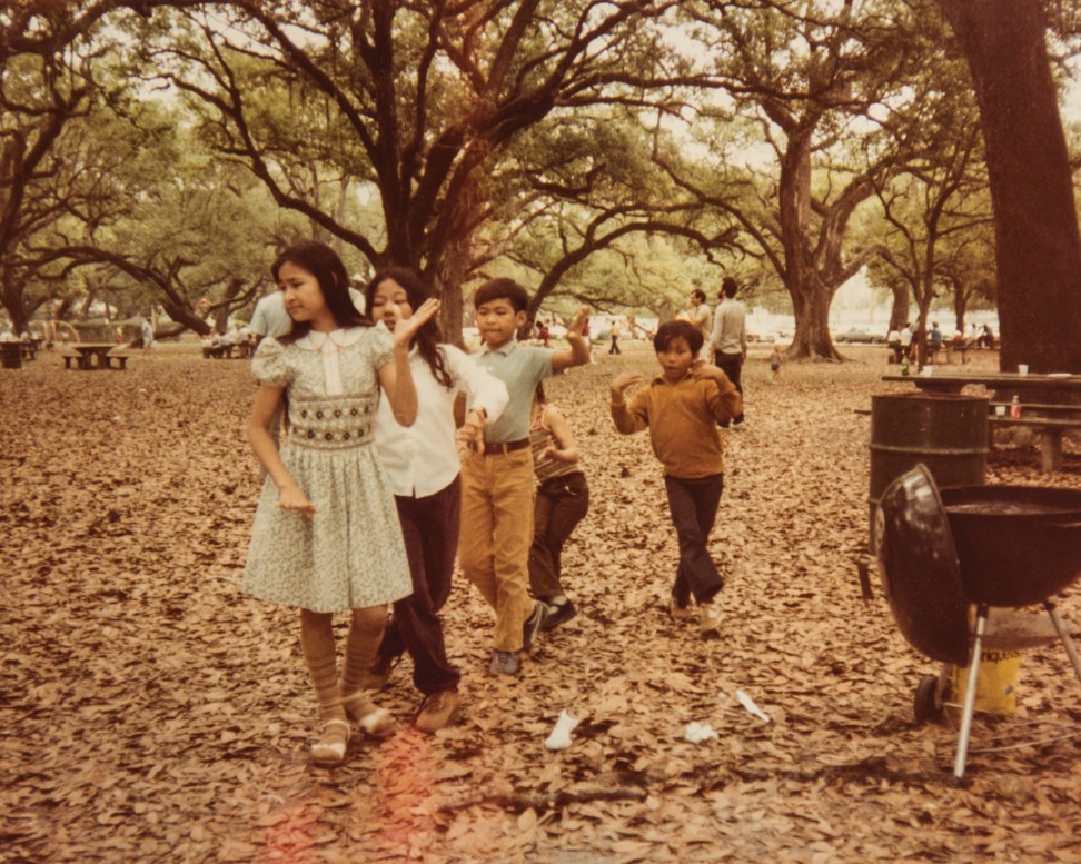 Sundary Rama (left) and Nadirak Rama (centre) dance with other Khmer children in a park in New Orleans. The Ramas were one of a small number of Khmer families who resettled in New Orleans. Photo: Charles Fox
