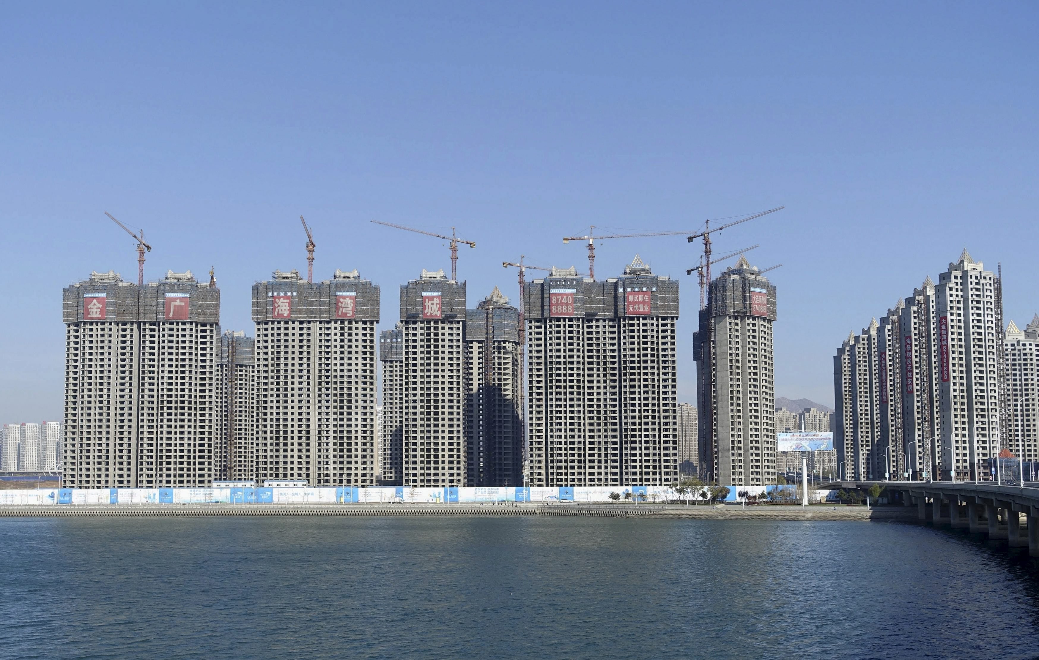 Residential buildings seen coming up in Dalian, Liaoning province, in November 2015. China on Tuesday ruled out easing property curbs to stimulate the economy. Photo: Reuters/China Daily