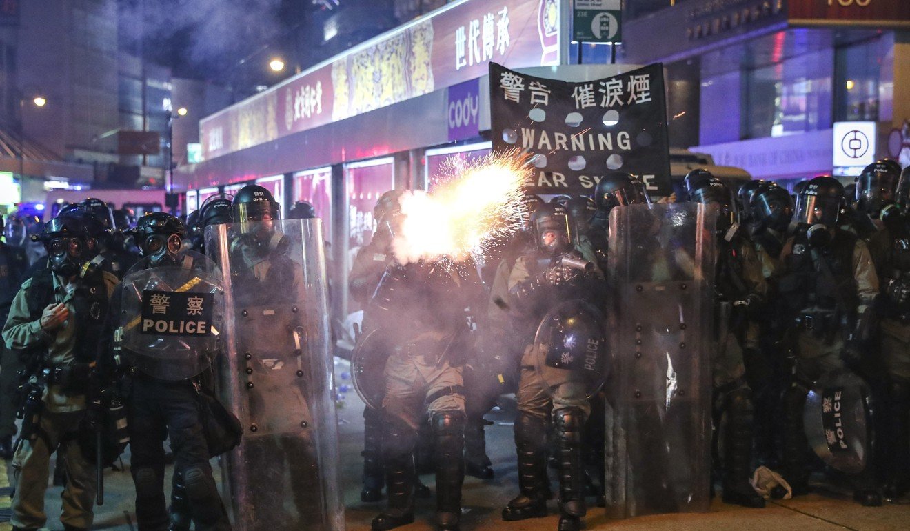 Riot police fire tear gas rounds in clashes with protesters. Photo: Sam Tsang