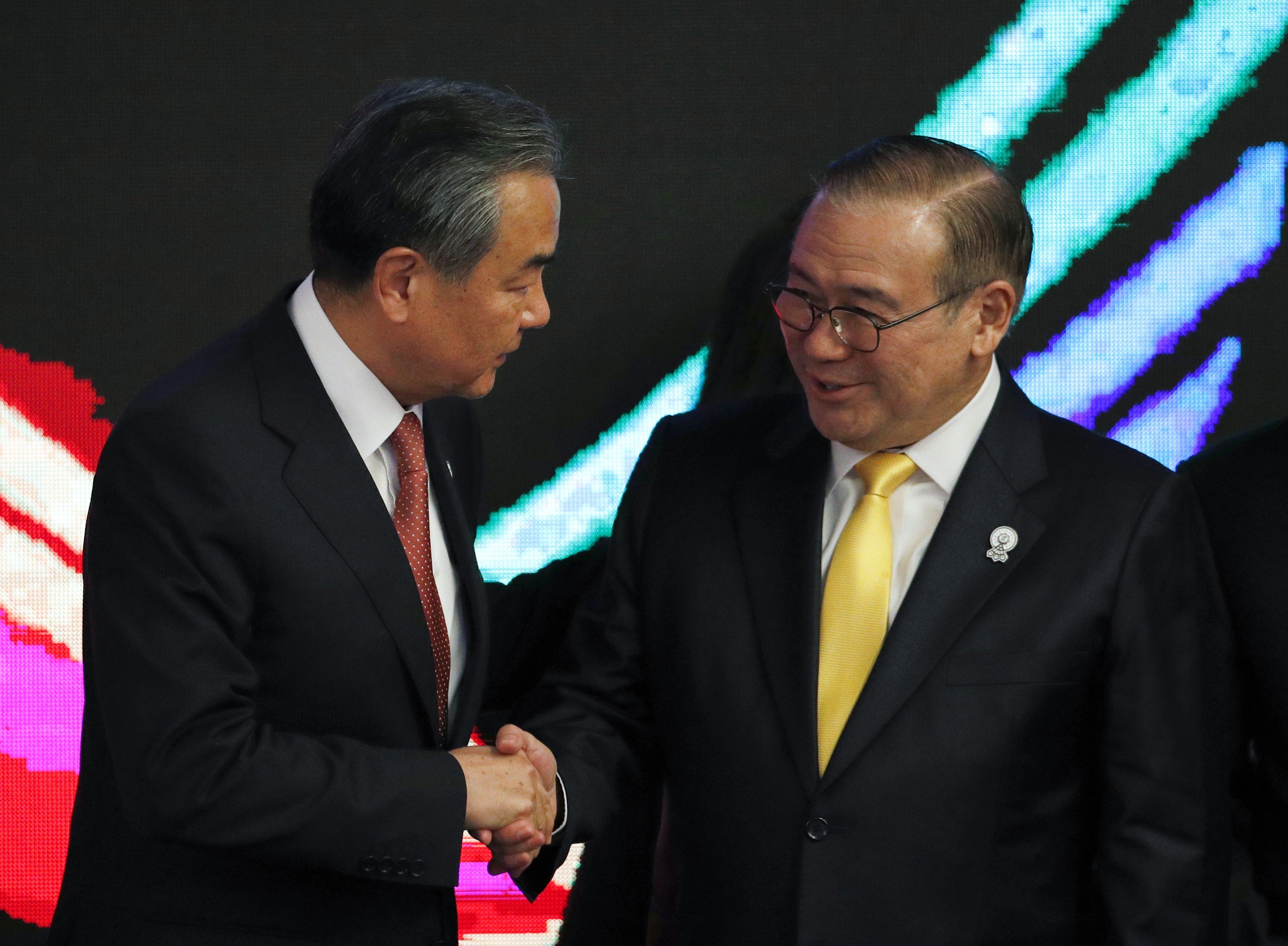 Chinese Foreign Minister Wang Yi with Philippines Secretary of Foreign Affairs Teodoro Locsin in Bangkok. Photo: EPA-EFE