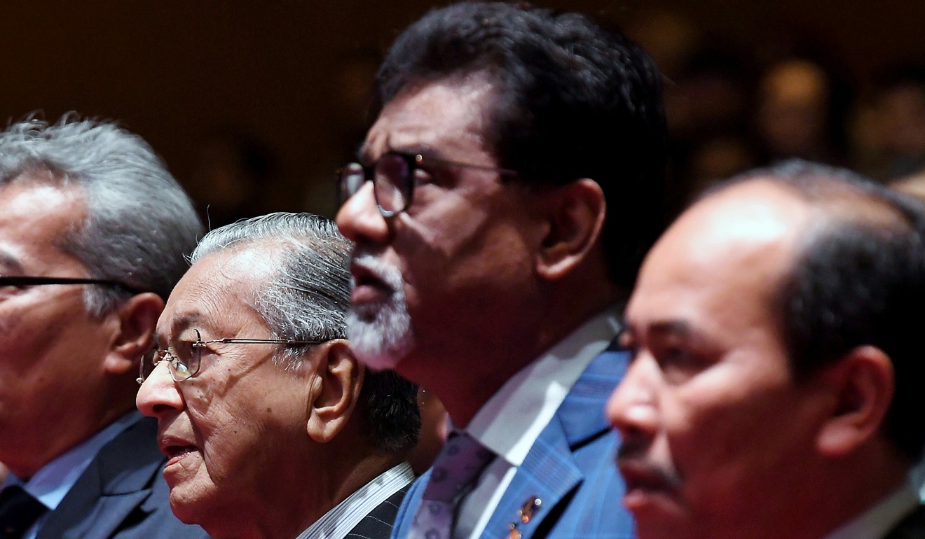 Water, Land and Natural Resources Minister Xavier Jayakumar (centre) with Malaysian Prime Minister Mahathir Mohamad (second from left). Photo: DPA