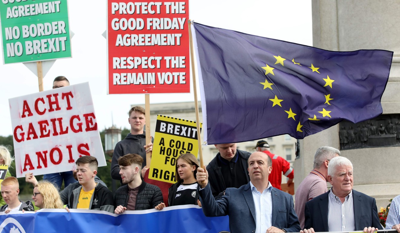 Anti-Brexit demonstrators protest outside Stormont house as Britain's Prime Minister Boris Johnson visits Belfast on Wednesday. Photo: AFP