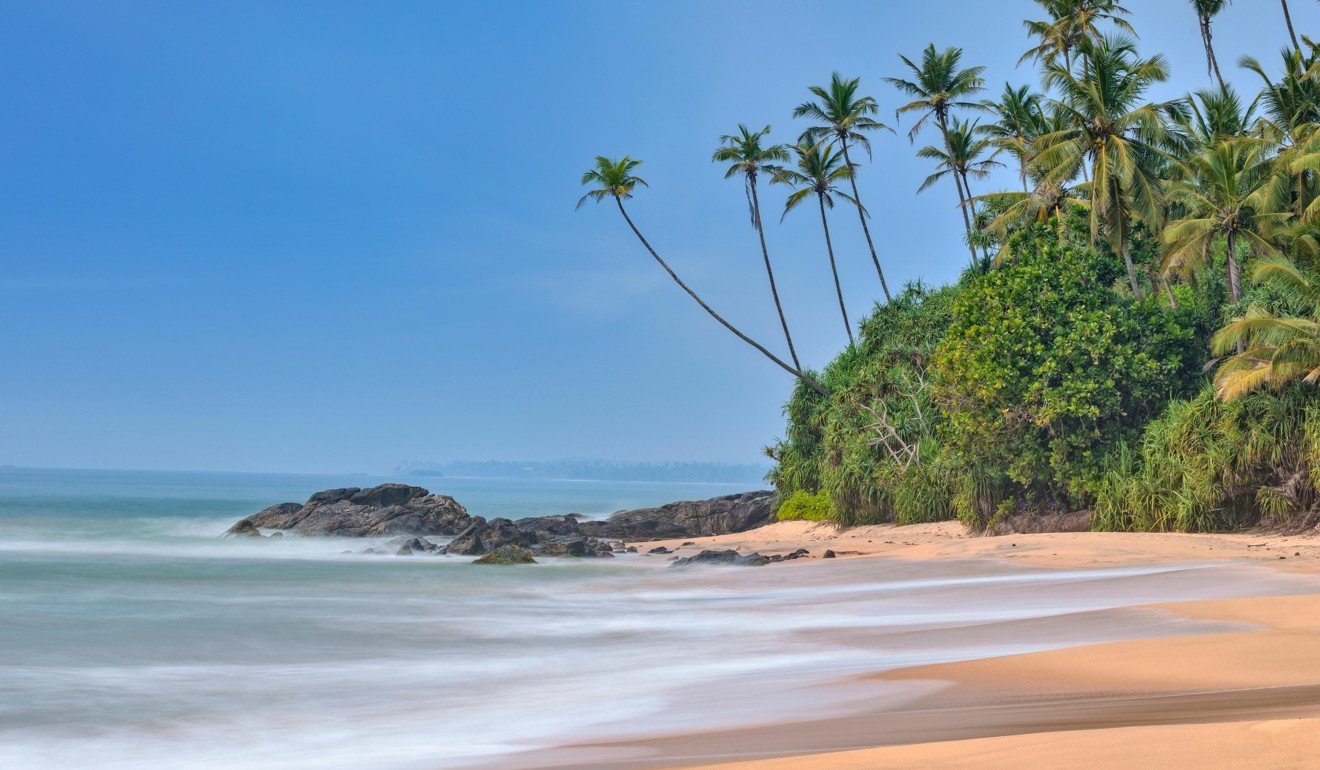 The beach at Dondra, Sri Lanka. The Indian Ocean waves are popular with surfers. Photo: Alamy