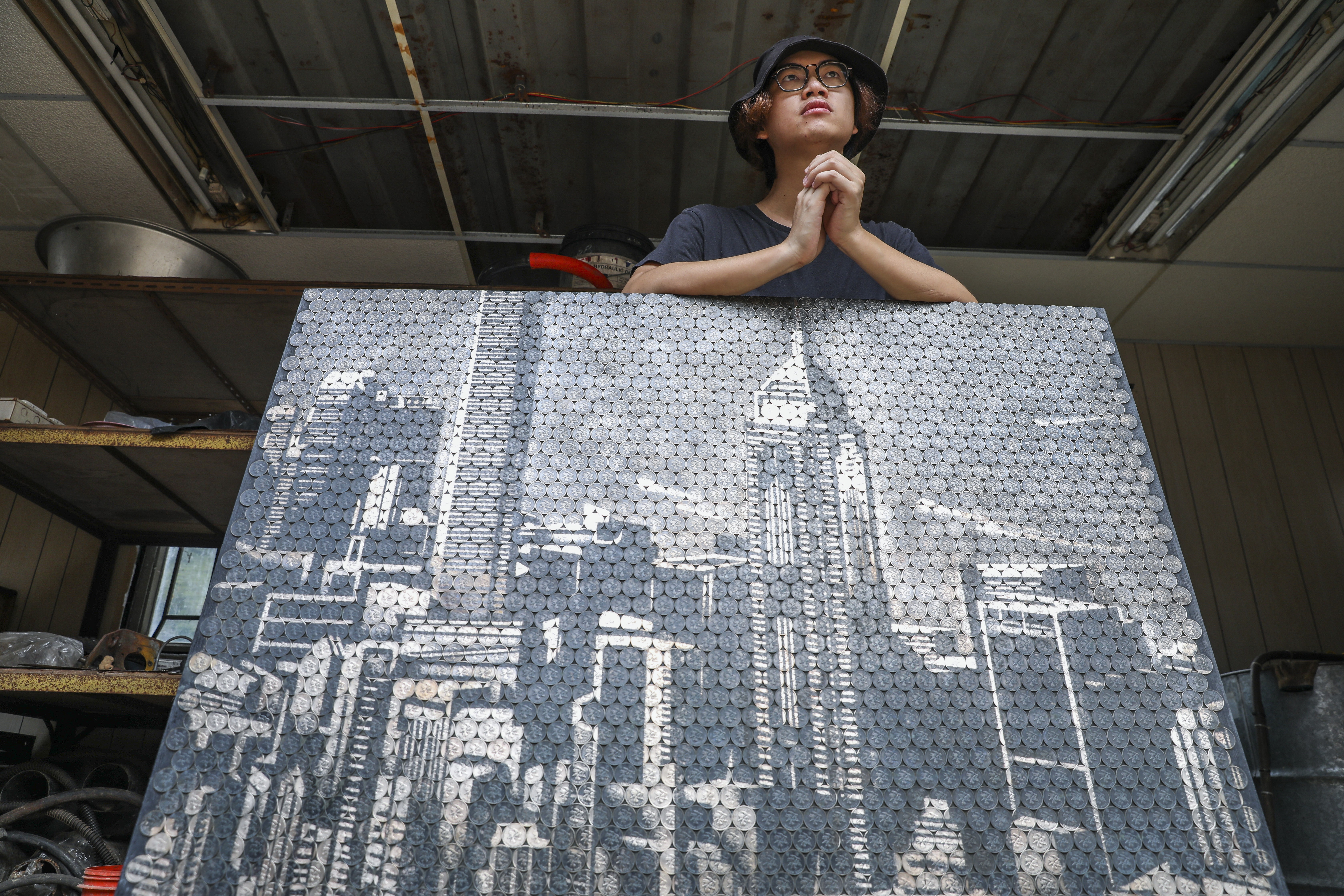 Giraffe Leung uses HK$1 coins to recreate the skyline of Hong Kong’s moneyed Central district. Photo: Nora Tam