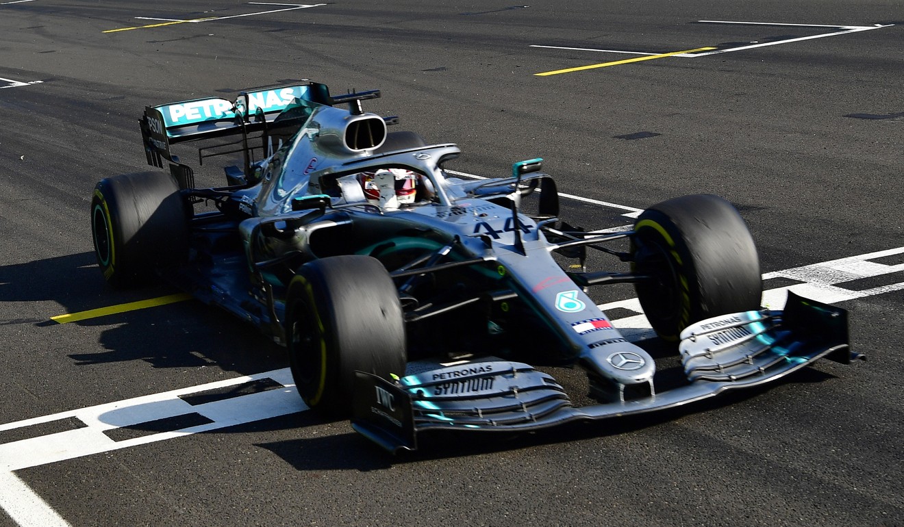 Hamilton’s car crosses the finish line on Sunday. Photo: Reuters