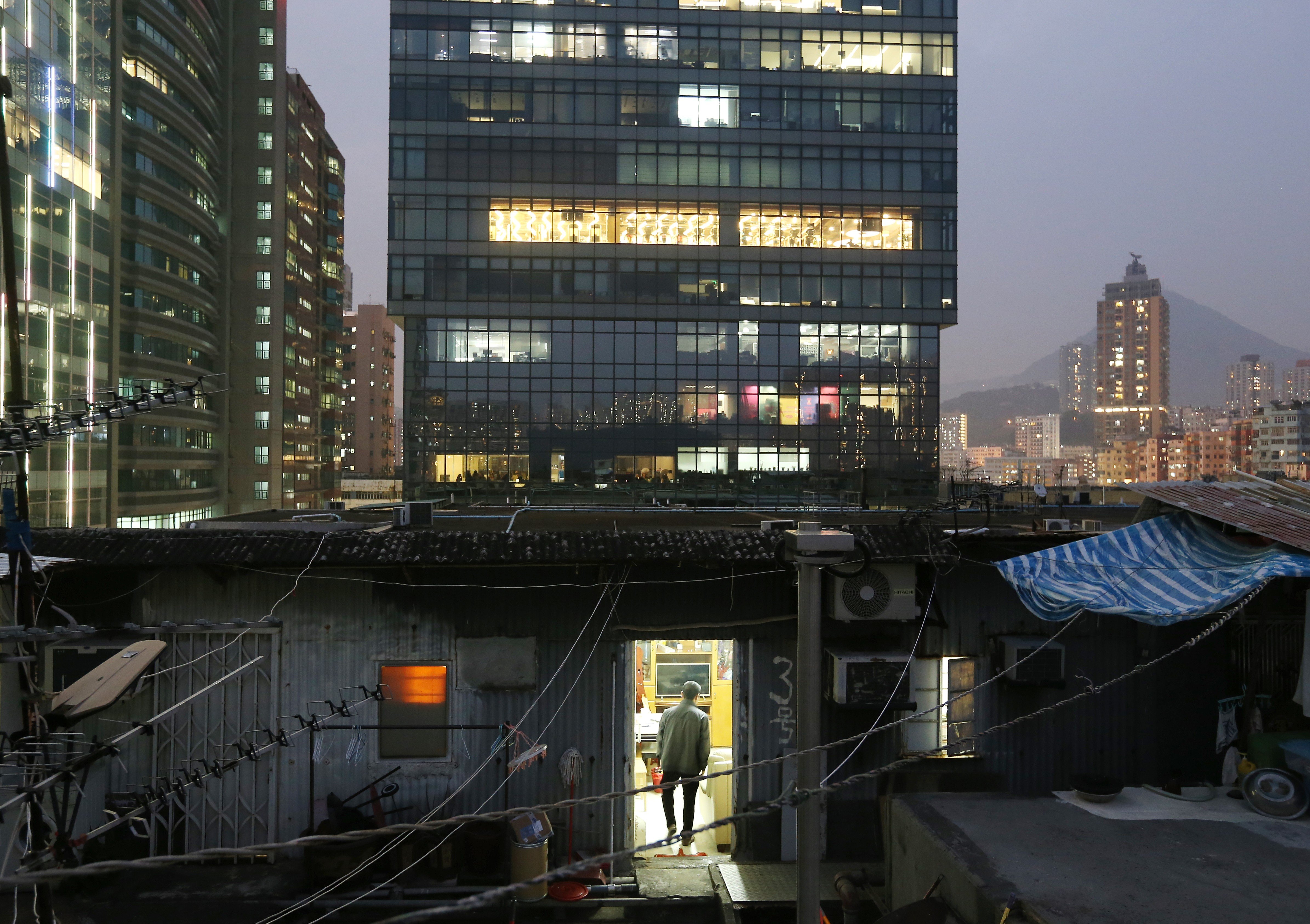 Illegal cubicle homes on the rooftop of an industrial building in Kwun Tong. The source of Hong Kong’s misery is its economic system, the wrong-headed belief that the free market alone will solve every social problem. Photo: Dickson Lee