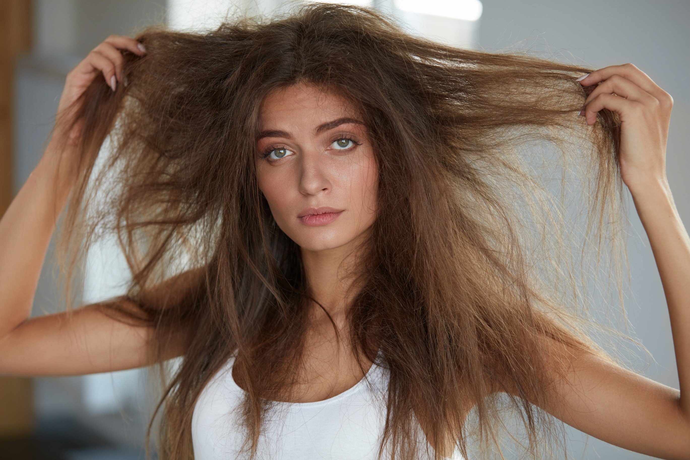 How to deal with your frizzy hair this summer: salon keratin treatments give you smooth shiny hair and it’s also possible to treat yourself at home.