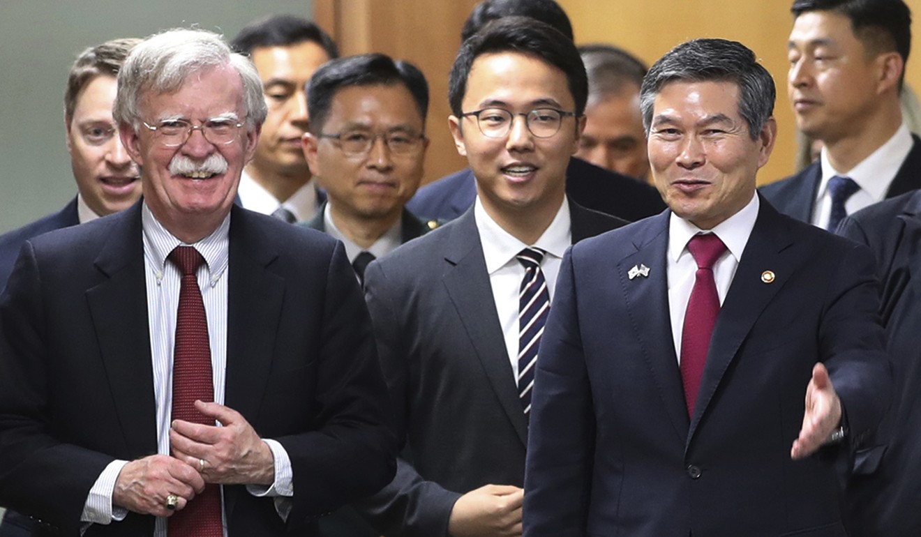 South Korean Defence Minister Jeong Kyeong-doo (front right) with US National Security Advisor John Bolton (left) in July. Photo: AFP