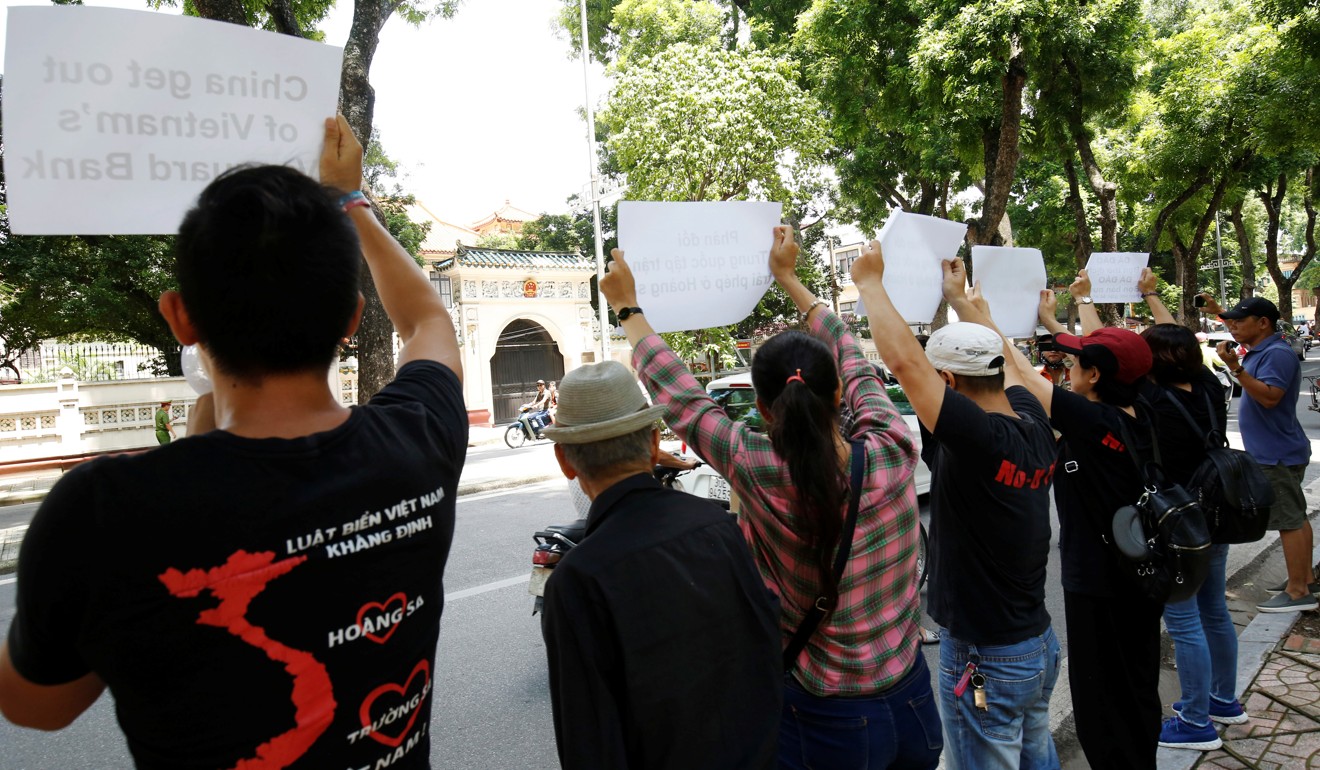 Anti-China protesters in front of the Chinese embassy in Hanoi. Photo: Reuters