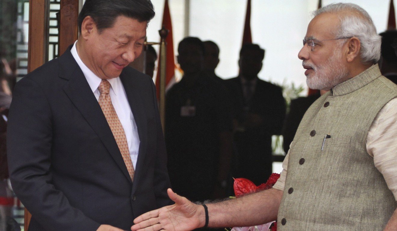 Chinese President Xi Jinping arrives in Ahmadabad, welcomed by Indian Prime Minister Narendra Modi. New Indian census data shows far fewer Chinese call India home. Photo: AP