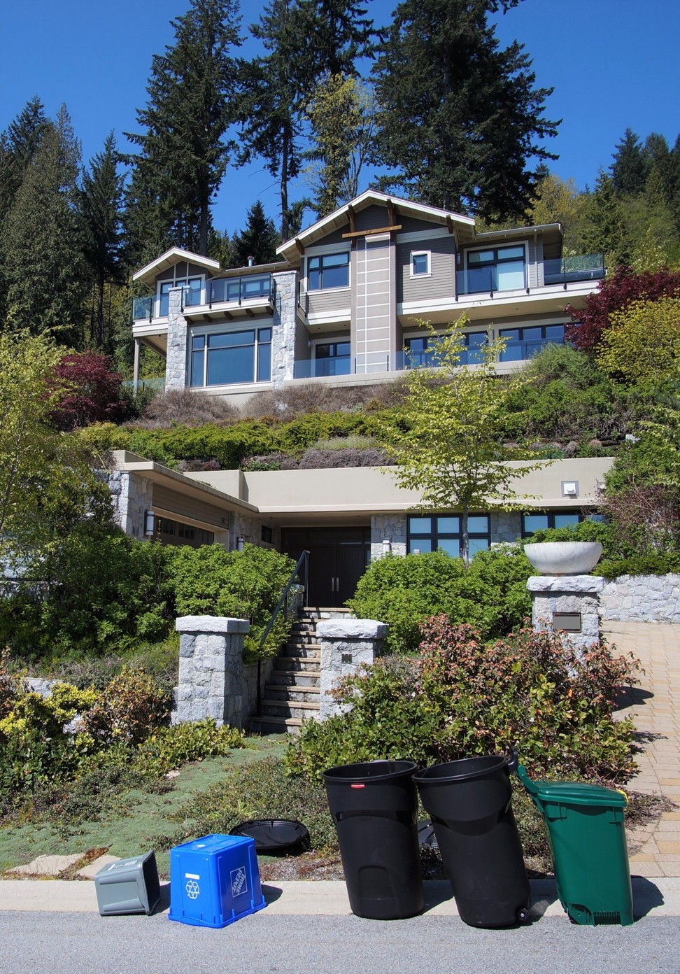 Rubbish bins outside a home in Vancouver where Li Jianhua once intended to live. Photo: Ian Young