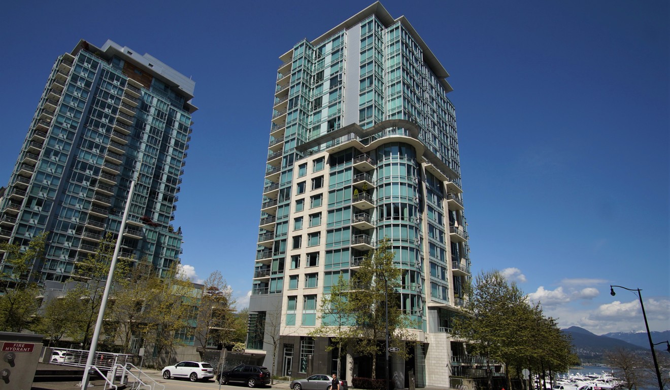 Carol Li Xiaoqi is laying claim in a Canadian lawsuit to the C$1.9 million proceeds from the sale of a flat in this waterfront Vancouver tower. Photo: Ian Young