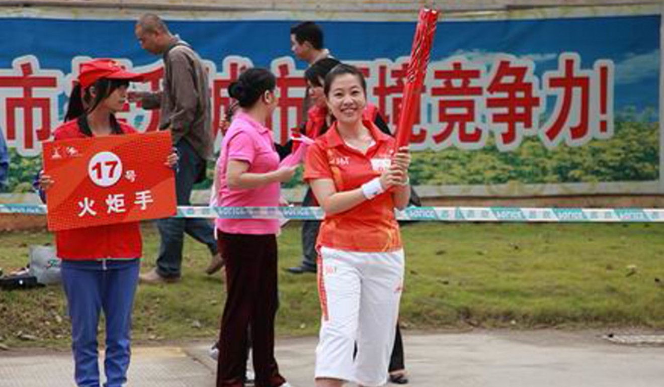 Carol Li Xiaoqi, pictured during the Meizhou City leg of the 2010 Asian Games torch relay. Photo: Eastmoney user photo
