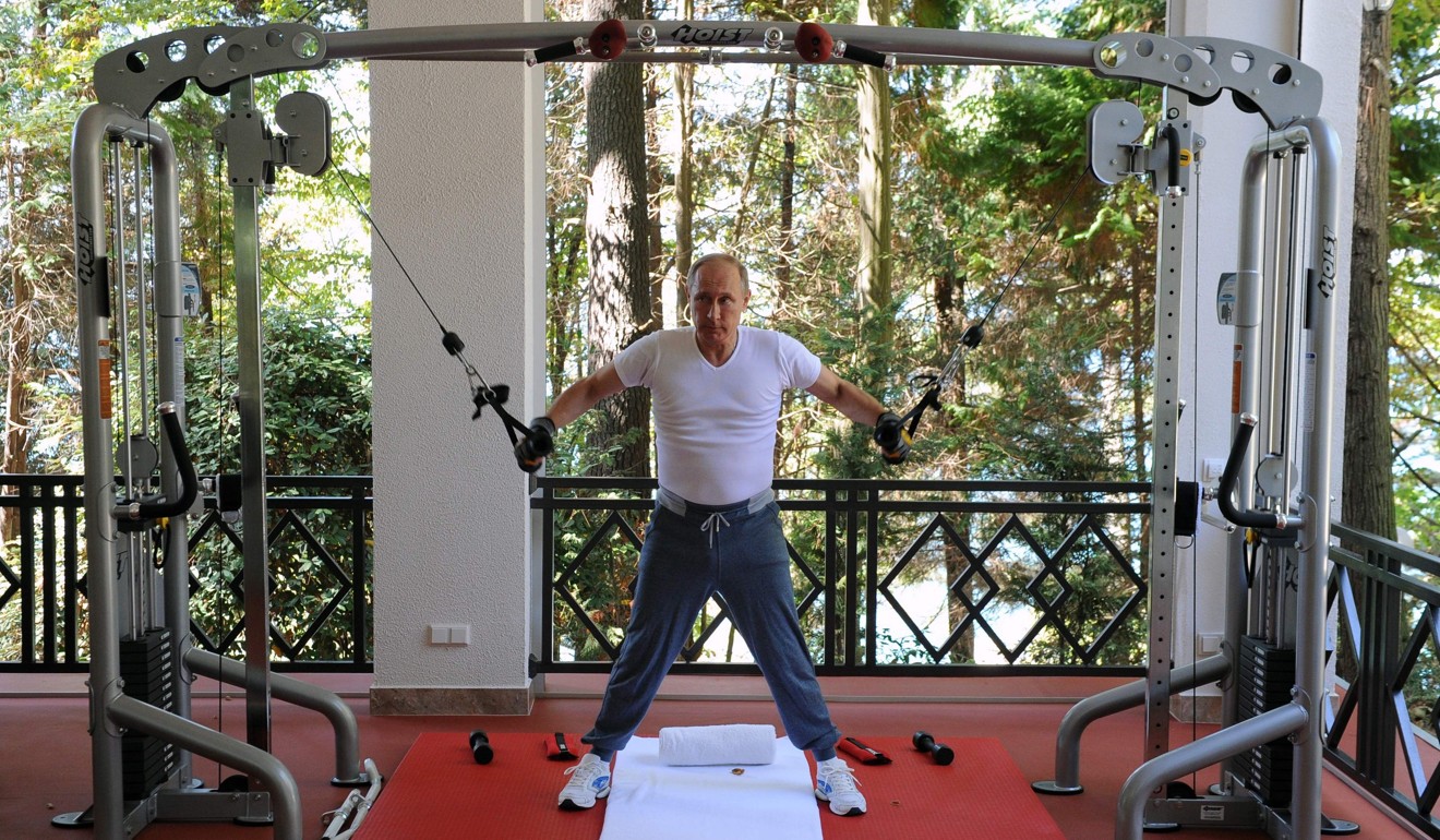 Russia’s President Vladimir Putin works out at a gym at the Bocharov Ruchei state residence in Sochi. Photo: AFP