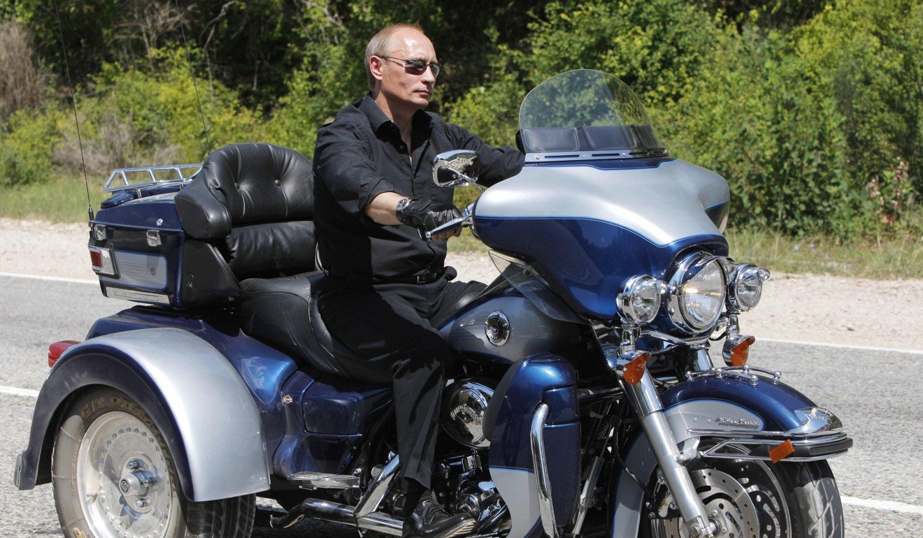 Vladimir Putin, then Russian prime minister, rides Harley-Davidson Lehman Trike. File photo. AFP