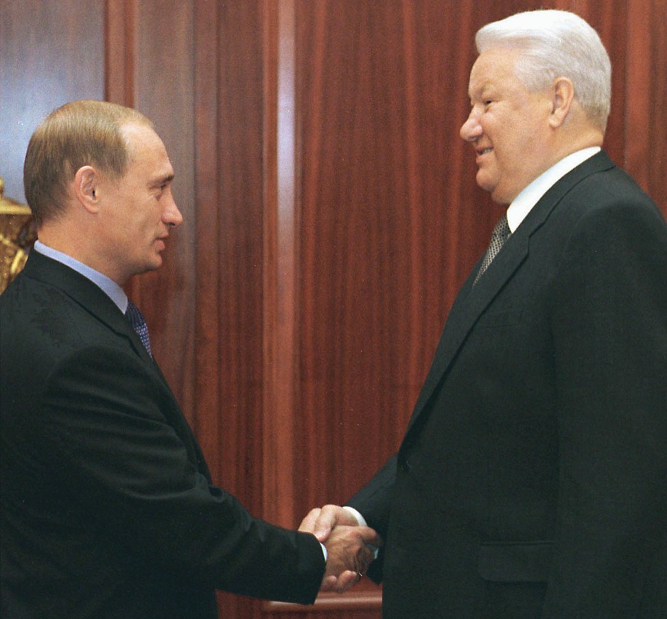 Russian President Boris Yeltsin shakes hands with Prime Minister Vladimir Putin during a meeting in 1999. Photo: AFP