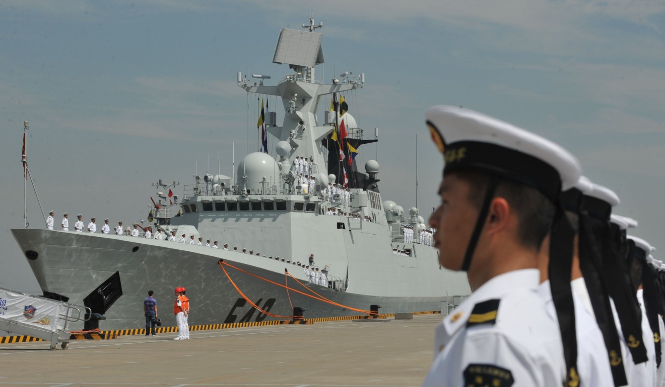 Members of the PLA Navy stand guard as the 12th Chinese naval escort flotilla sets sail from a port in Zhoushan in July 2012 for a mission in the Gulf of Aden and Somali waters to protect commercial ships from pirate attacks. Photo: Xinhua