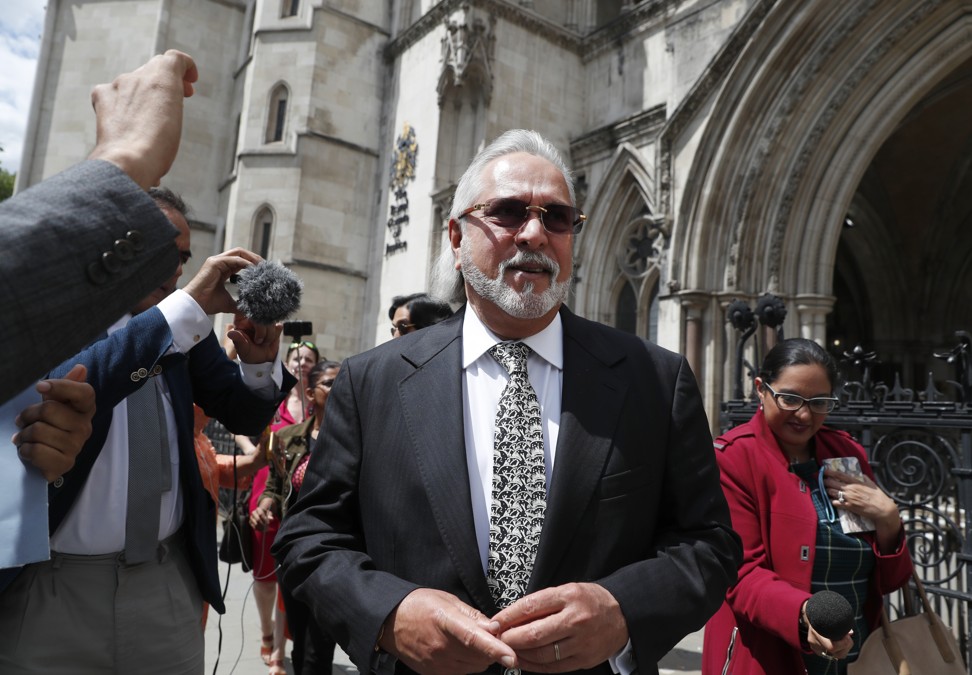 Vijay Mallya outside the Royal Courts of Justice in London last month. He has won the right to challenge in court Britain’s decision to order his extradition to India to face fraud charges. Mallya, whose business empire once included Kingfisher beer, left India 2½ years ago after defaulting on debts of more than US$1 billion linked to a failing venture, Kingfisher Airlines. Photo: AP
