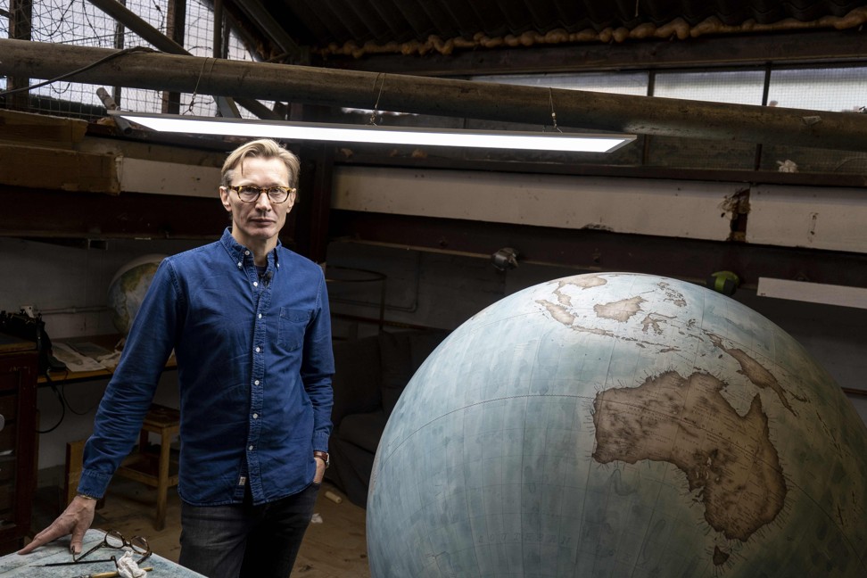 Peter Bellerby at his workshop with one of his company’s larger creations. Photo: AFP