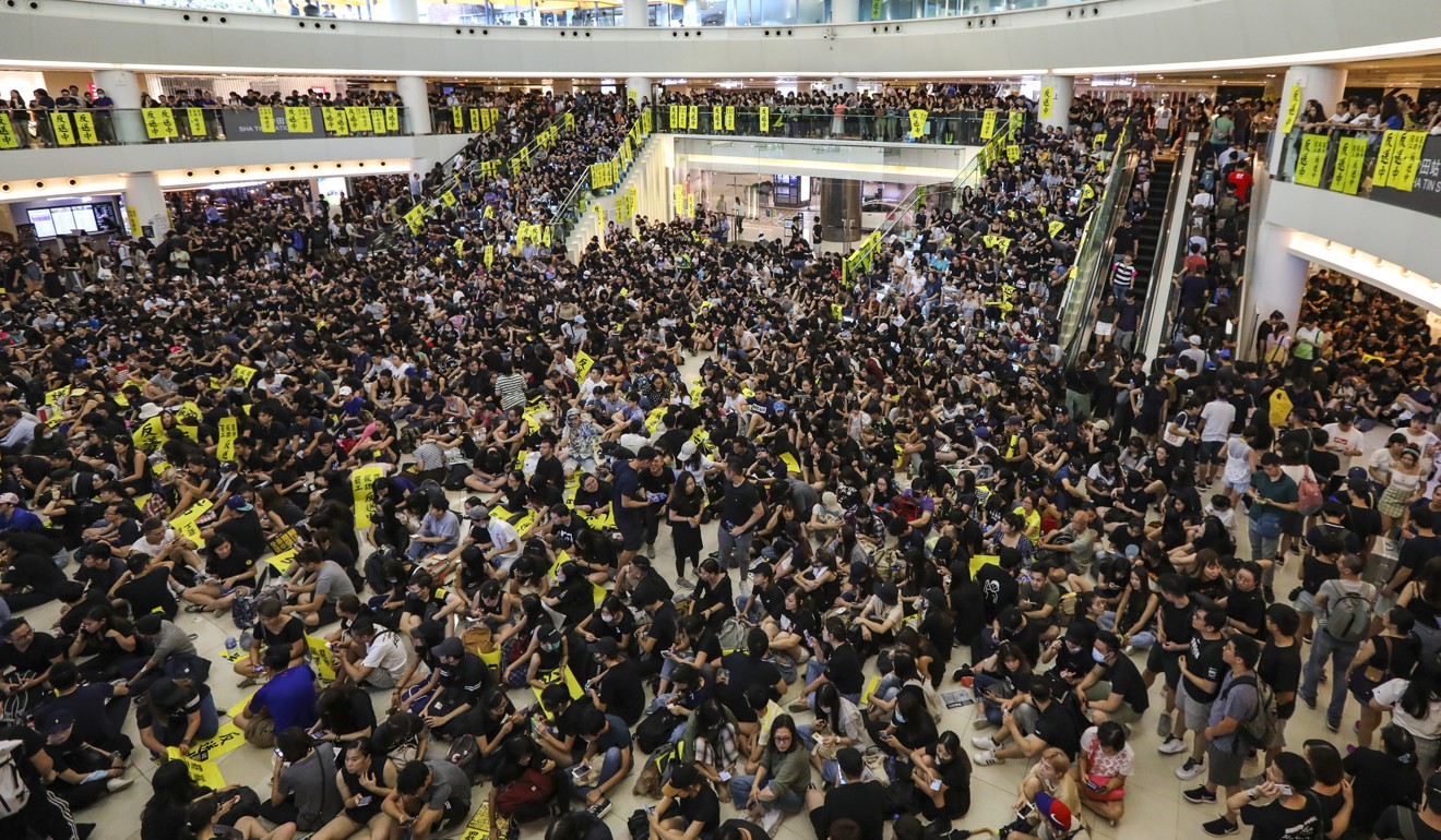 Anti-government protesters occupy Sha Tin New Town Plaza after stopping MTR services earlier in the morning of August 5. Photo: Felix Wong