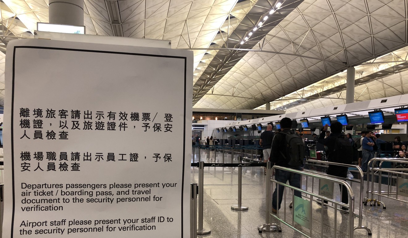 A notice for passengers as they arrive at the airport on Friday ahead of a protest that has heightened security. Photo: Danny Lee