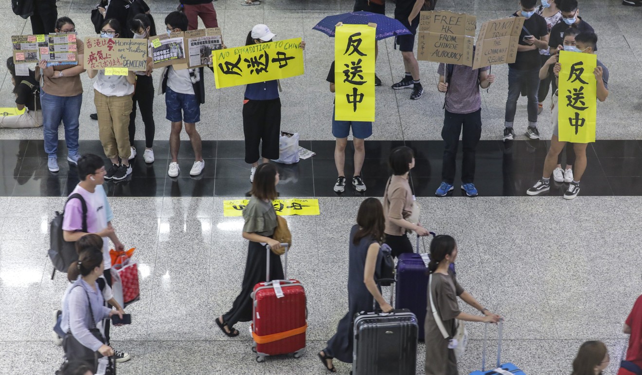 Protesters highlighted their cause to passengers at Hong Kong airport during Monday’s citywide strike. Airport bosses have increased security ahead of a protest set to start on Friday lunchtime. Photo: May Tse