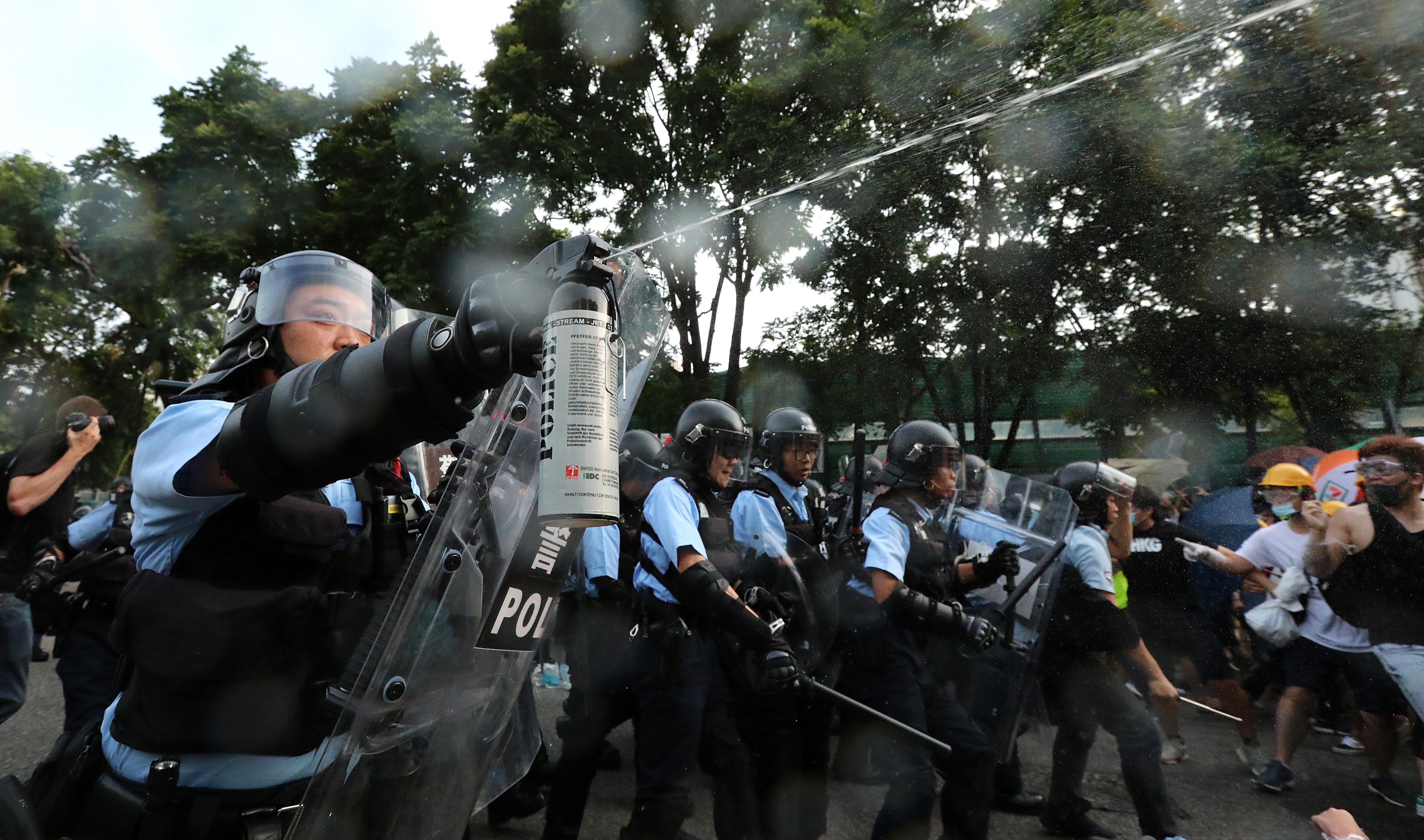 Protesters clash with police after a march in Sheung Shui on July 13, 2019. Photo: Felix Wong