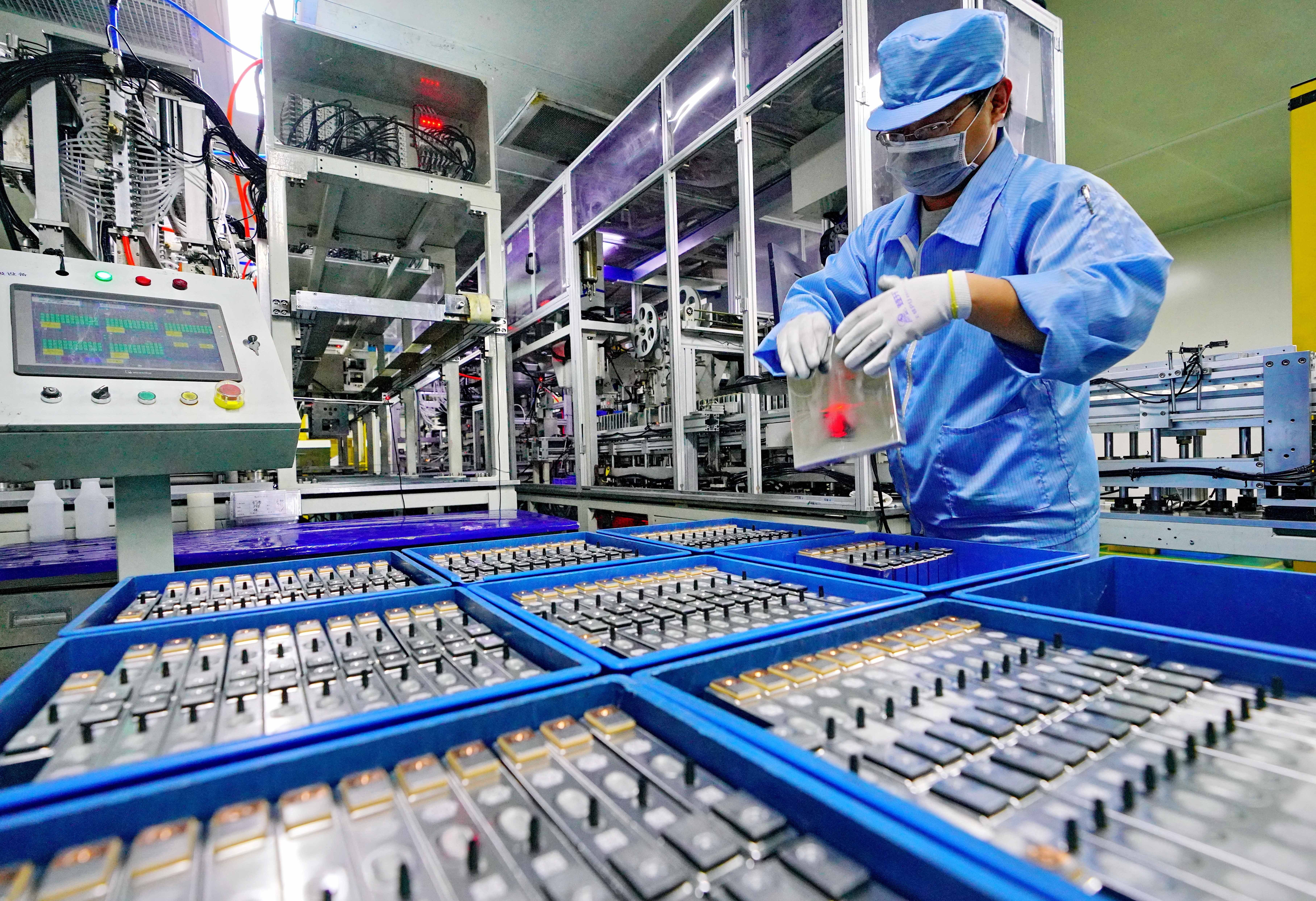 A worker is seen on a production line at a lithium battery manufacturing plant for automotive use in Tangshan, north China's Hebei Province, April 11, 2019. photo: Xinhua