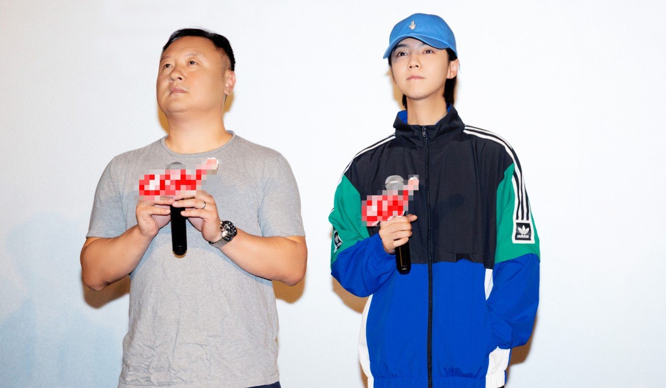 Shanghai Fortress director Teng Huatao (left) and its star Lu at a screening of the film.