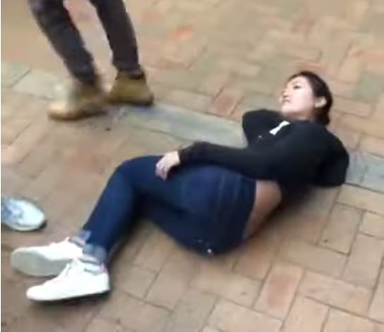A screenshot from the video shows 27-year-old Hongkonger Serena Lee on the ground after being shoved. Photo: YouTube