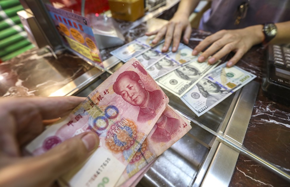 China’s yuan fell below the key level of 7 to the US dollar last week for the first time in 11 years. Photo: Roy Issa