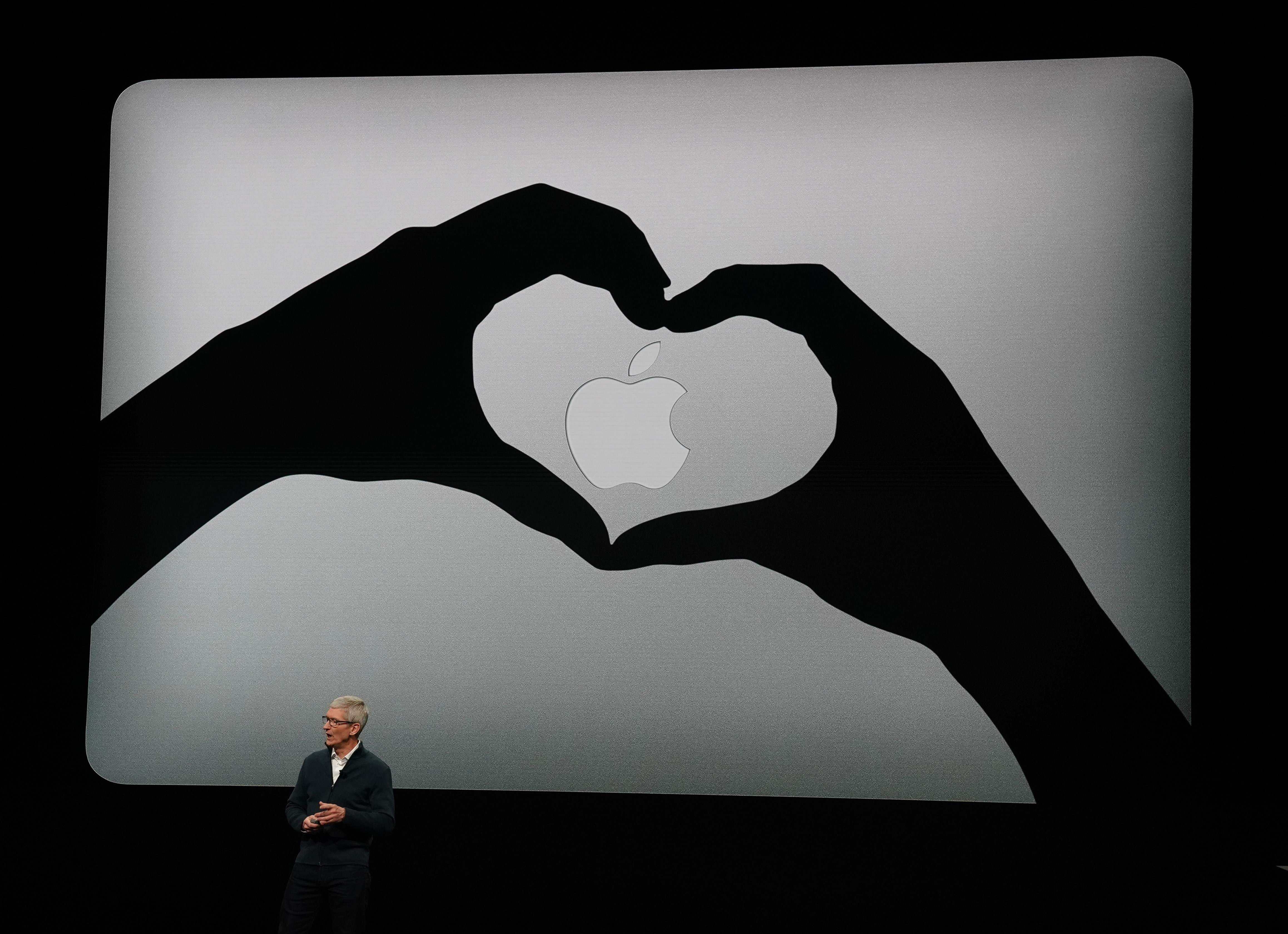 Apple CEO Tim Cook presents new products, including MacBook laptops, during an event in New York. Photo: AFP