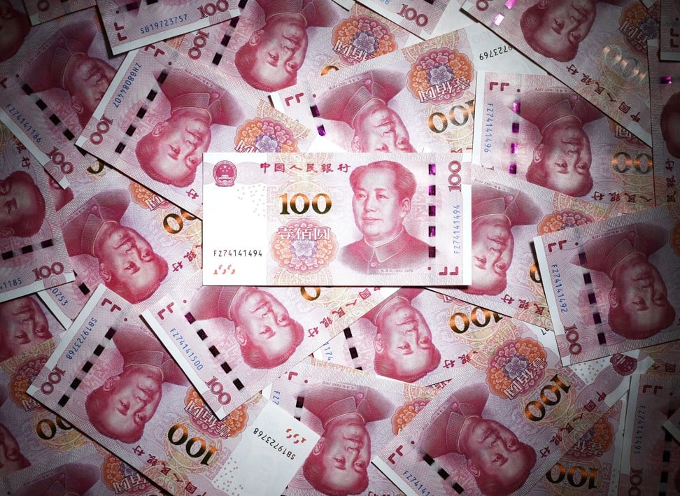 Over the first sevens months of the year, Chinese banks extended 3.8 trillion yuan (US$538 billion) in long-term loans to companies, down from 4.2 trillion yuan during the same period last year. Photo: Kyodo