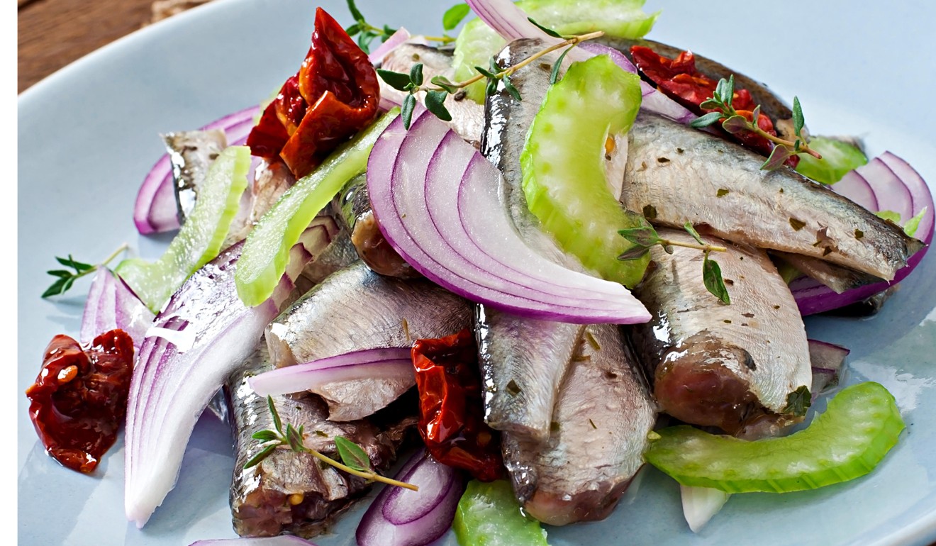 Herring salad with sun-dried tomatoes, celery and red onion. Photo: Alamy