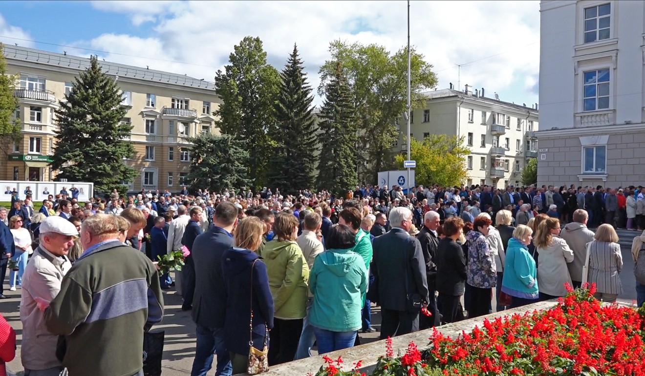 People gather on Monday for the funerals of five Russian nuclear engineers killed by a rocket explosion. Photo: Rosatom via AP