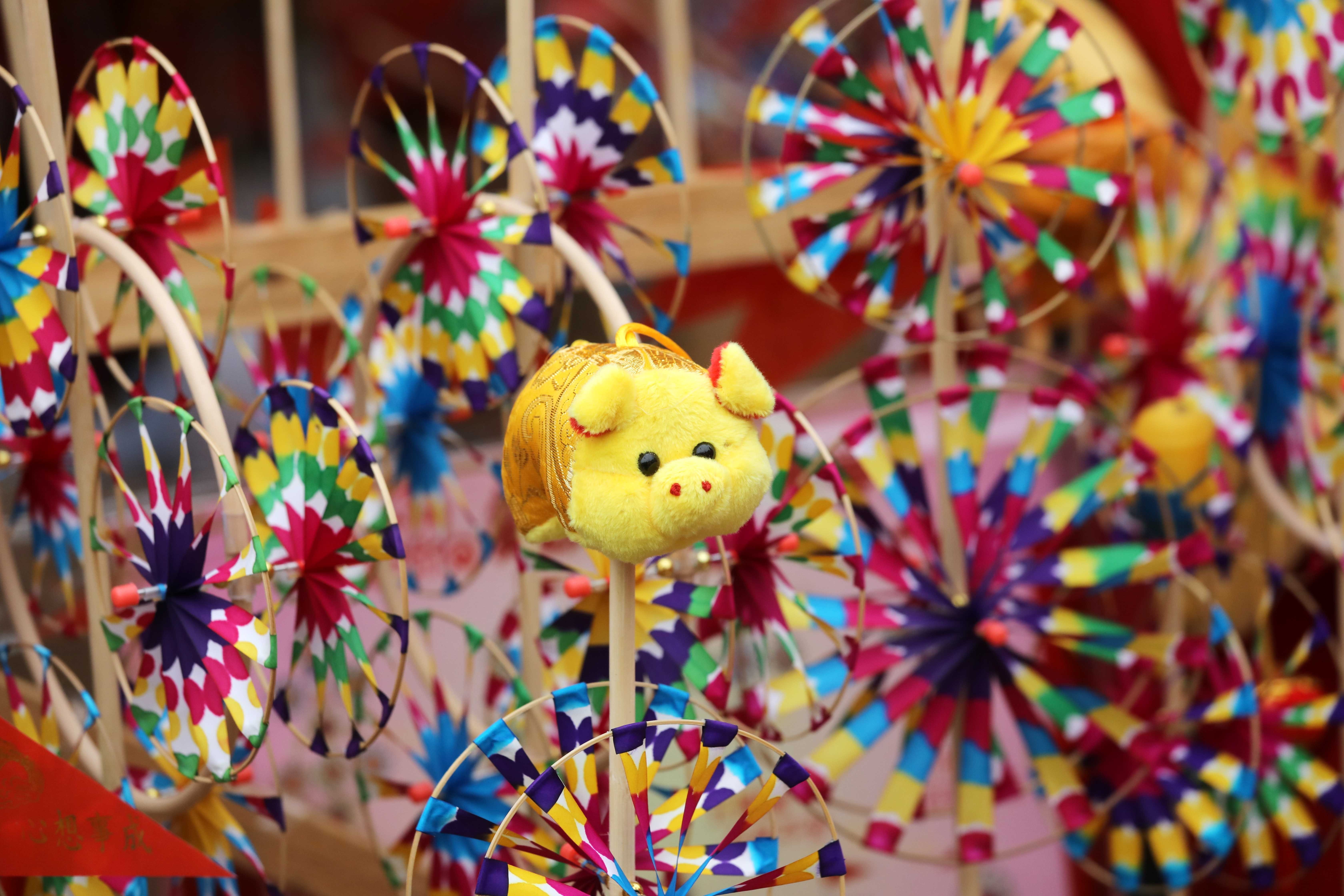 A windmill topped by a pig is on display at the Lunar New Year fair market at Victoria Park, Causeway Bay, on February 1. Predictions for Hong Kong’s future are commonly made during the Lunar New Year festival. Photo: Dickson Lee