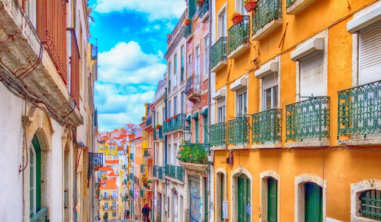 Lisbon, the small, charming capital of Portugal, is known for its streets of vibrant-coloured traditional homes.