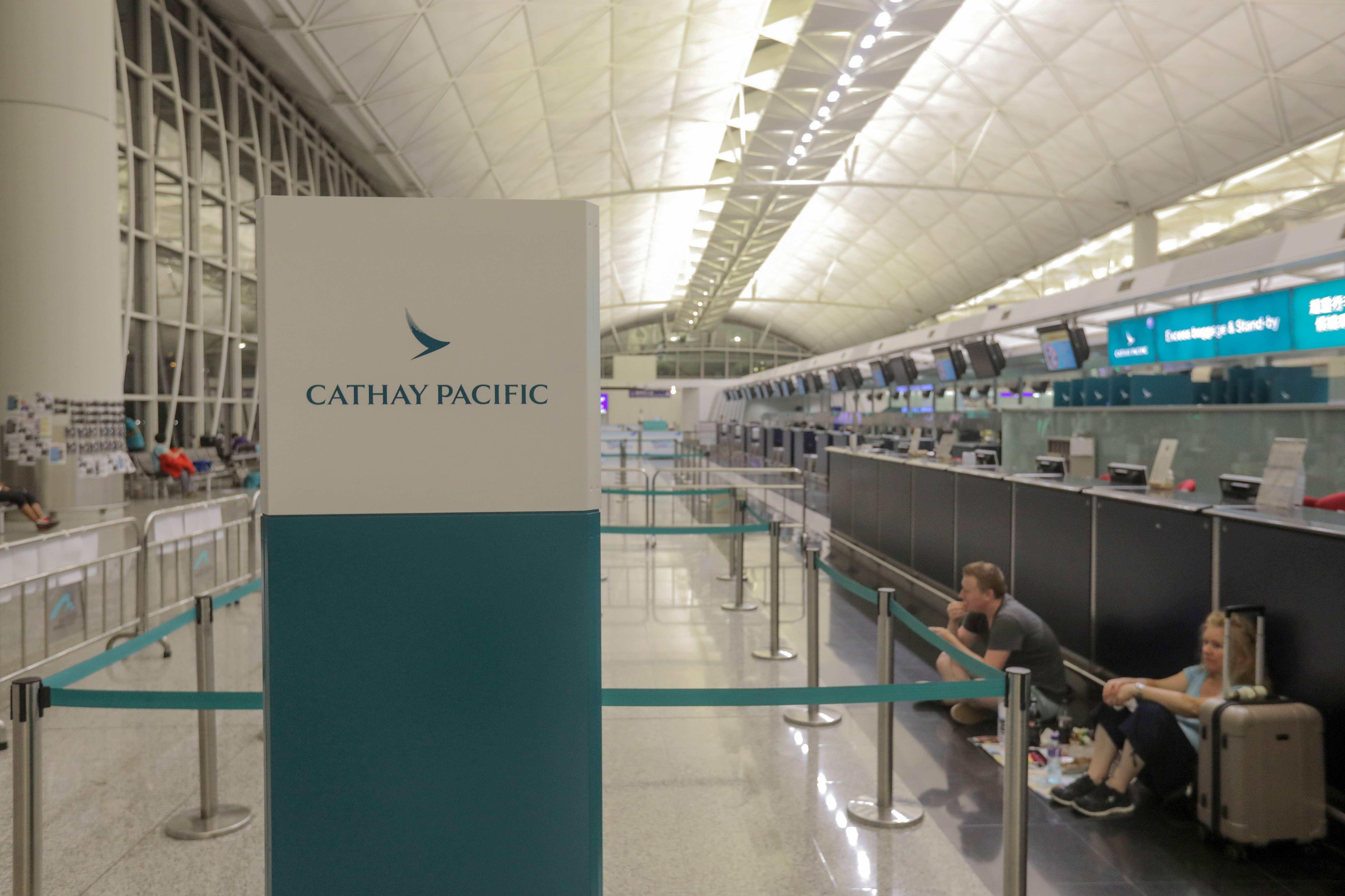 A deserted Cathay Pacific Airways check-in area, after all flights were cancelled over protests at Hong Kong International Airport against alleged police brutality and the now-shelved extradition bill, on August 12. A fifth of Cathay’s flights are directed at the China market, comprising 24 destinations on the mainland. Photo: AFP