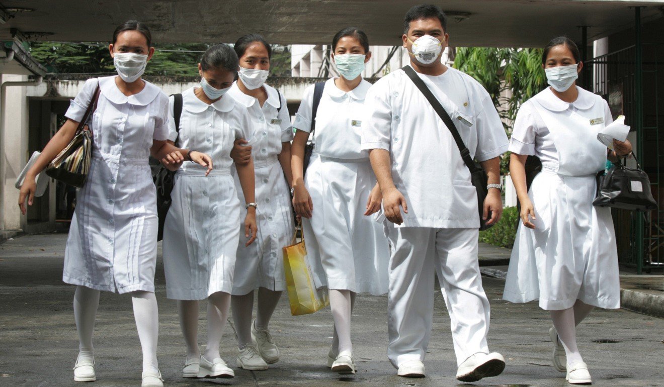 Filipino health workers in Manila. File photo: Reuters