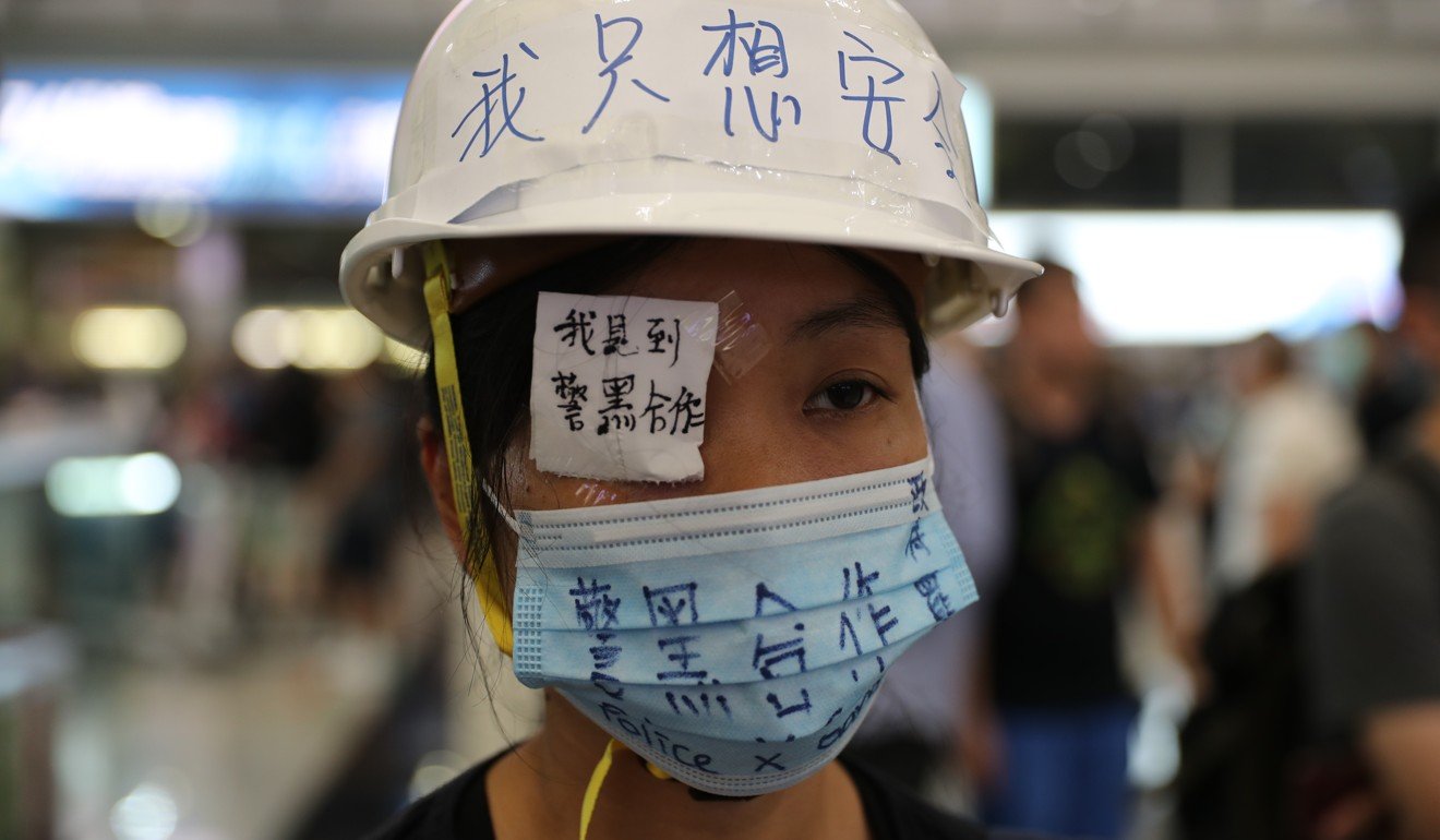A protester at Hong Kong airport wears an eye patch in reference to the woman hit by a bean bag round in Tsim Sha Tsui. Photo: Sam Tsang