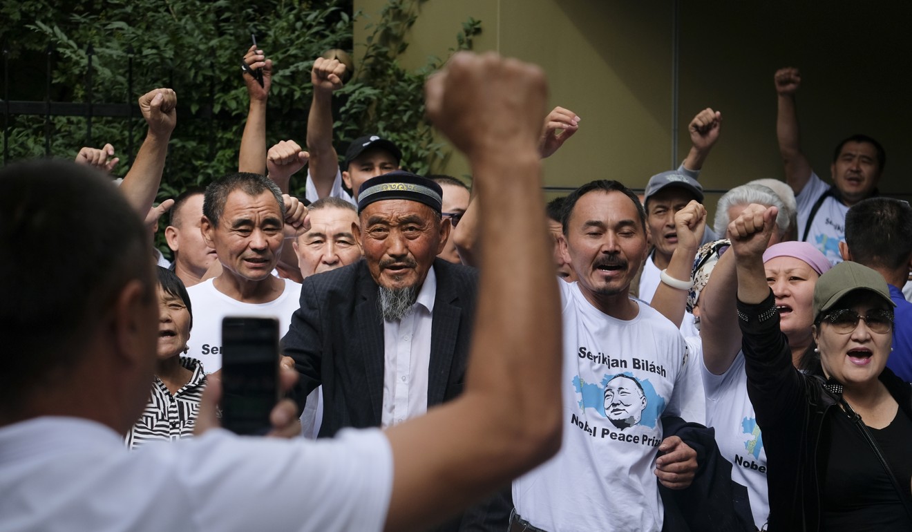 Supporters of Serikjan Bilash in front of a court building in Almaty, Kazakhstan, on Friday. Photo: AP