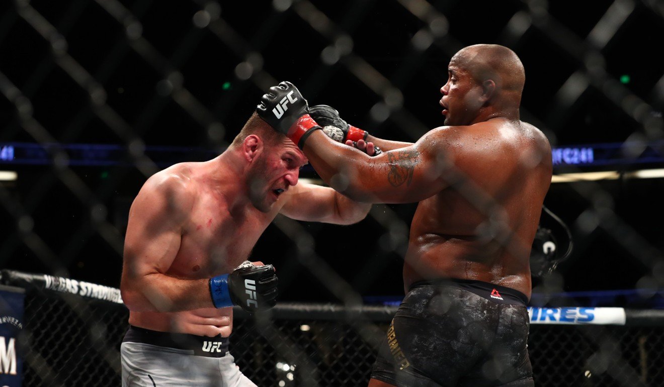 Stipe Miocic and Daniel Cormier in action in the third round.