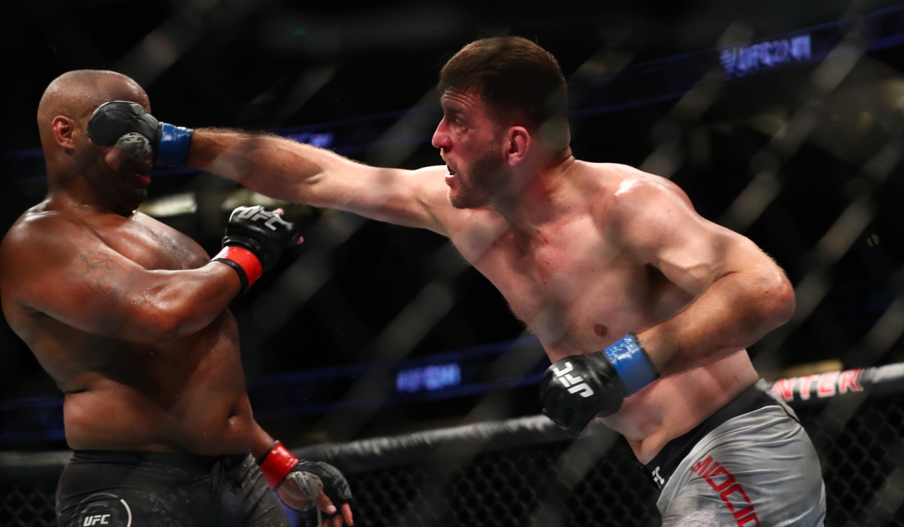 Stipe Miocic throws a punch at Daniel Cormier in the second round.