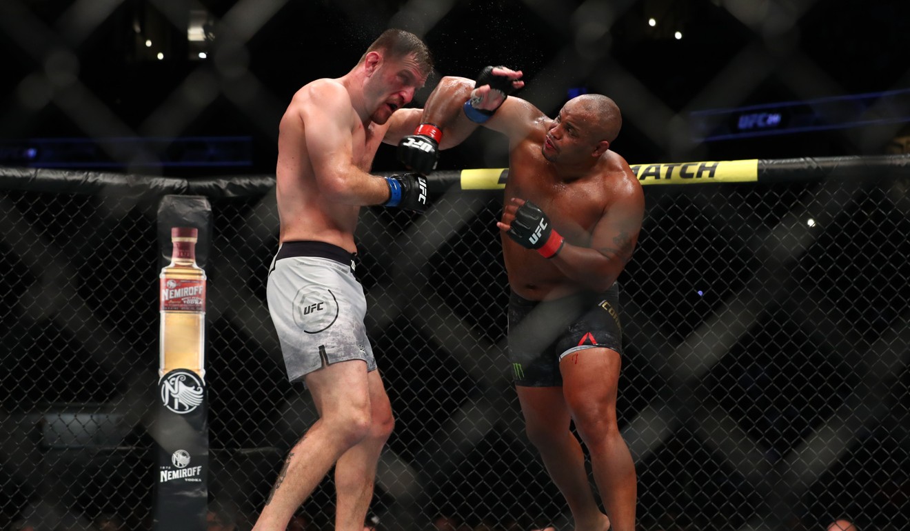 Stipe Miocic and Daniel Cormier get tangled during the third round during at UFC 241. Photo: AFP
