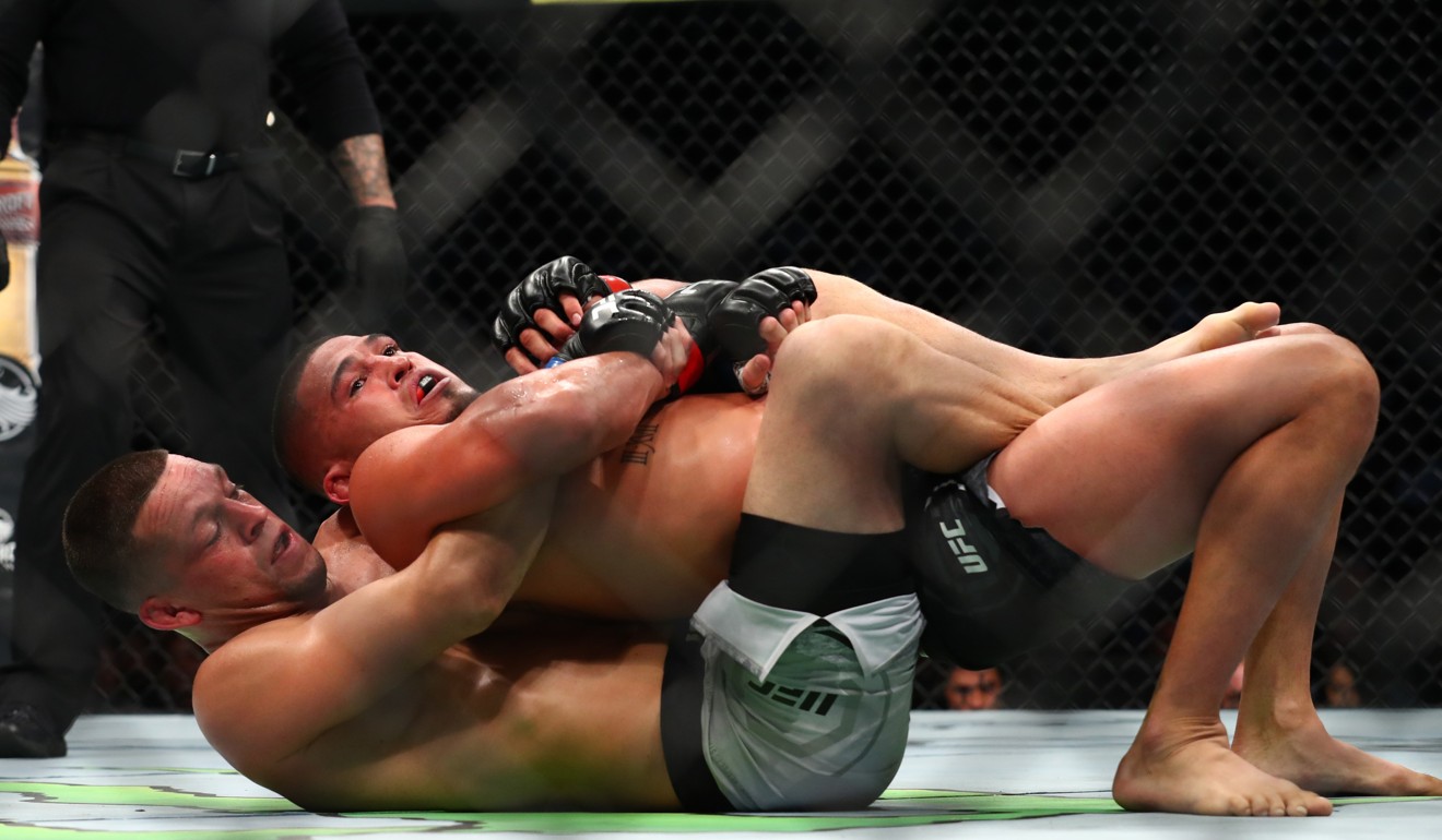 Nate Diaz and Anthony Pettis fight from the ground in the first round. Photo: AFP