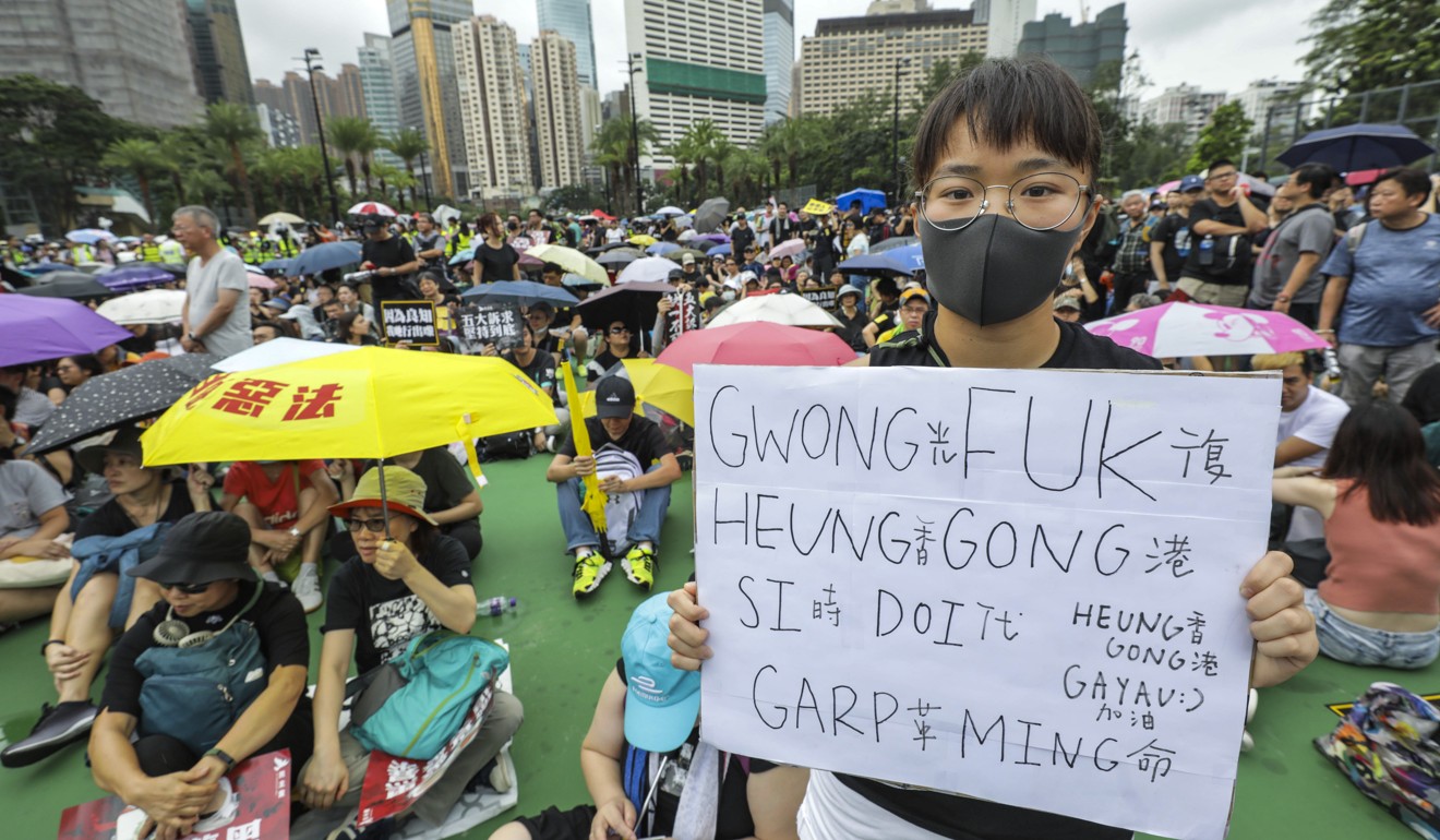 “Liberate Hong Kong; Revolution of our time,” reads a protester’s sign. Photo: May Tse
