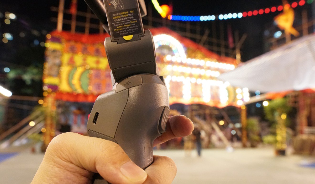 The DJI Osmo Mobile 3 has all the usual control buttons, including a trigger for quicker panning movement, and a dedicated shutter button to record without needing to touch the phone screen. Photo: Ben Sin