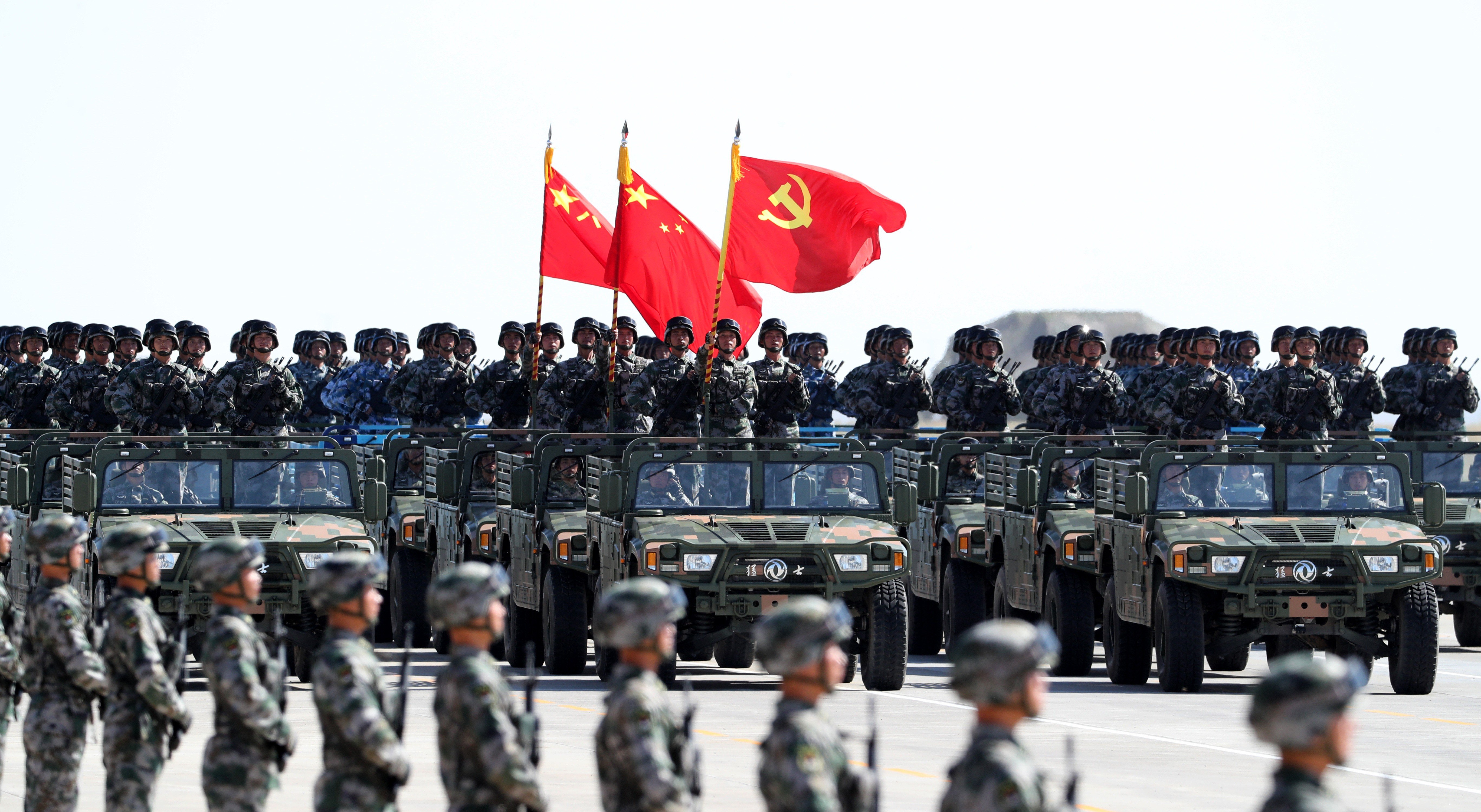 A formation of officers and soldiers from the army, air force, navy and rocket force of the Chinese PLA at a military parade. Photo: Xinhua