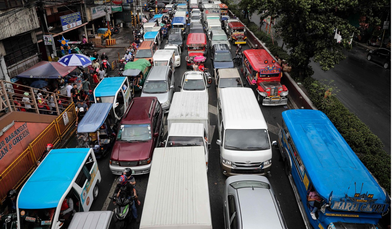 Buses and trains from outside Manila bring in some 2 million people daily. Photo: EPA